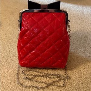 Red Quilted Women's Crossbody Bag with Silver Chain and Bow Clasp Accent